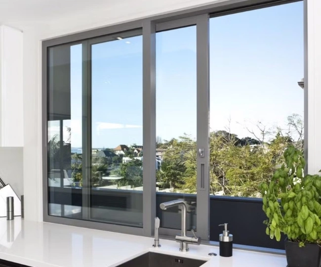 Pristine modern aluminium window repaired by RHS overlooking a Gibraltar marina.